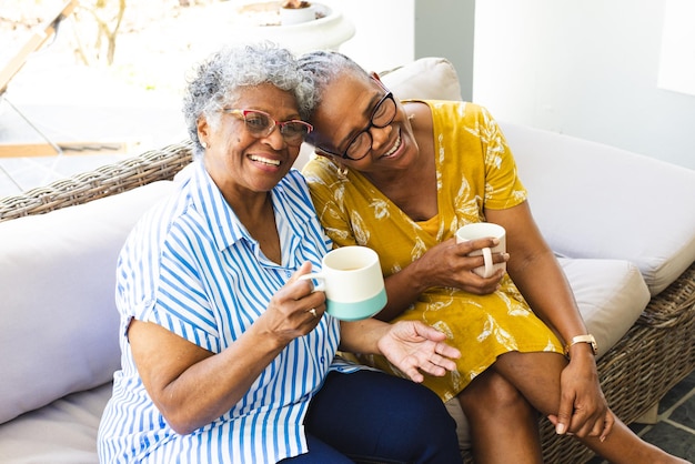 senior-african-american-woman-senior-biracial-woman-share-joyful-moment-with-coffee-home_13339-361759